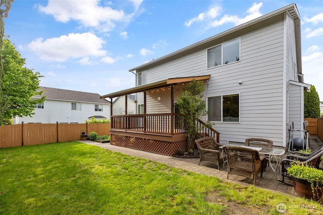 rear view of house with a deck and a patio area