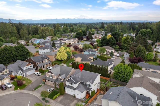 aerial perspective of suburban area featuring a mountain backdrop