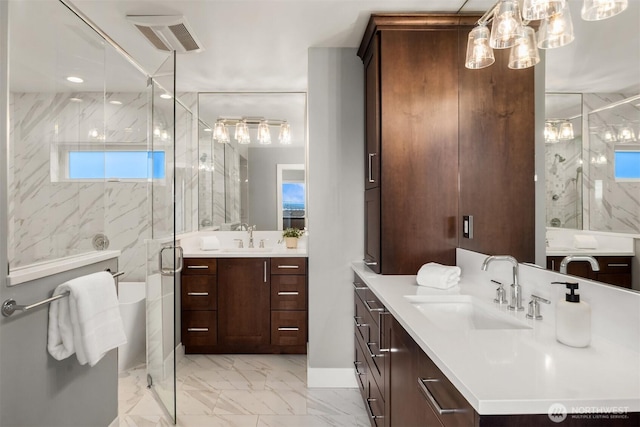 815 33rd Ave S, Seattle, WA 98144 - bathroom with marble finish floors, a shower stall, a chandelier, and two vanities