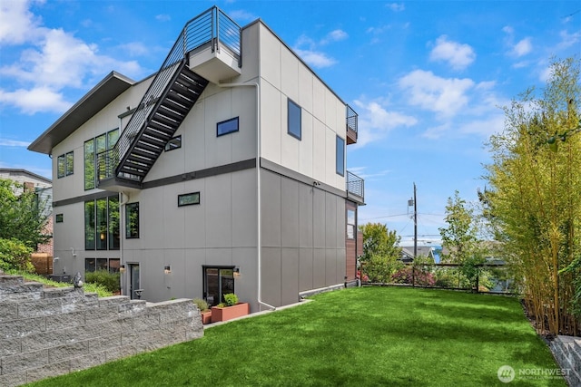 815 33rd Ave S, Seattle, WA 98144 - rear view of property with a yard and stairway