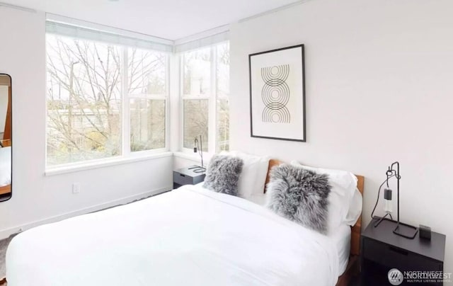 bedroom with multiple windows