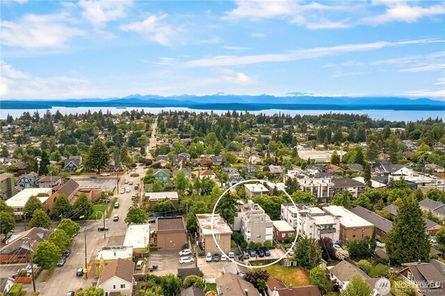 aerial perspective of suburban area with a water and mountain view