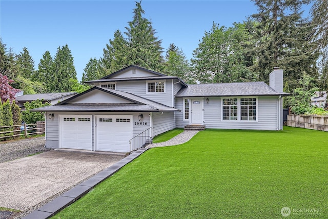 split level home with a chimney, driveway, an attached garage, and roof with shingles