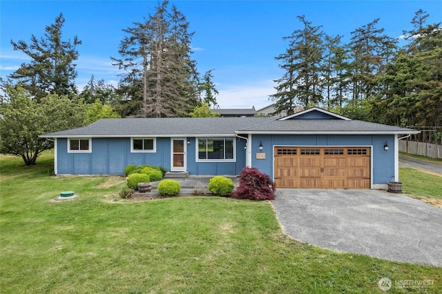 ranch-style home featuring driveway, a front lawn, a garage, and a shingled roof