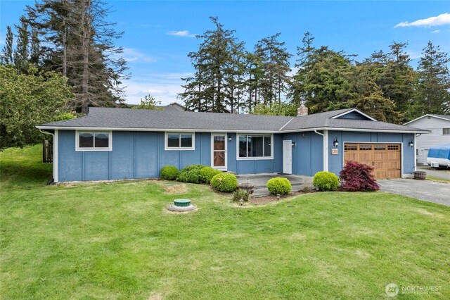ranch-style house featuring an attached garage, asphalt driveway, a front lawn, a chimney, and board and batten siding