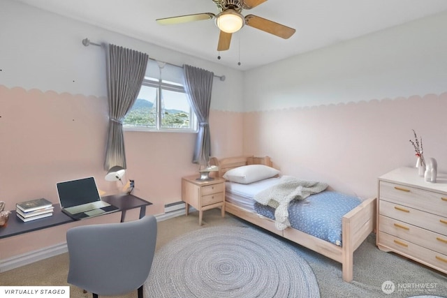 1310 Swantown Rd, Oak Harbor, WA 98277 - carpeted bedroom with a baseboard heating unit, a desk, and ceiling fan