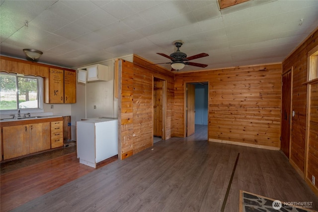 490 Morrison Canyon Ln, Cle Elum, WA 98922 - kitchen with a sink, wooden walls, light countertops, dark wood-type flooring, and ceiling fan