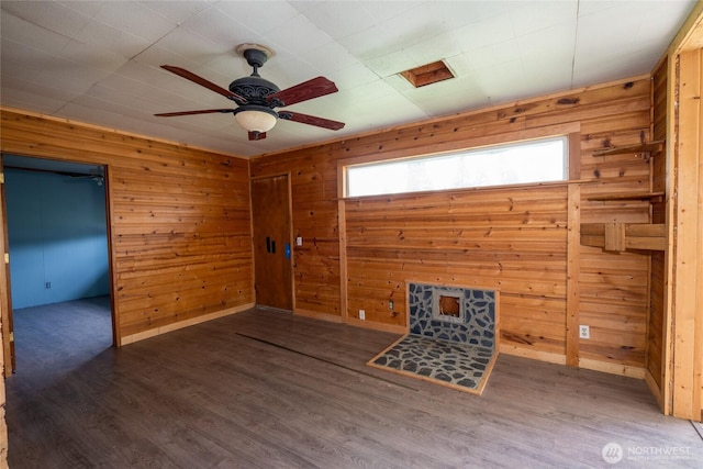 490 Morrison Canyon Ln, Cle Elum, WA 98922 - unfurnished room featuring wood walls, ceiling fan, wood finished floors, and baseboards