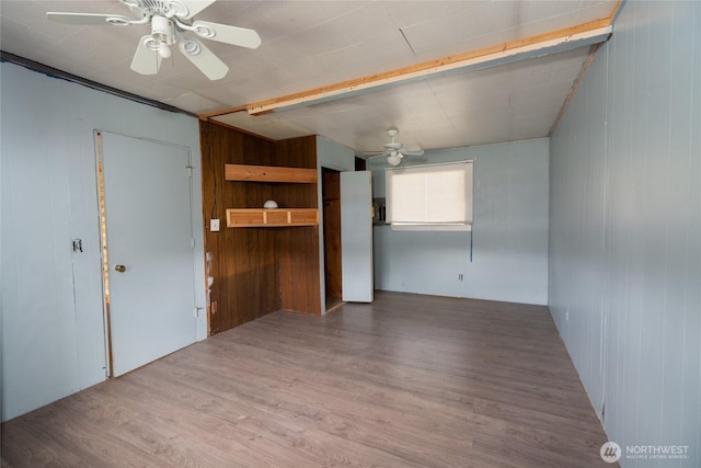 490 Morrison Canyon Ln, Cle Elum, WA 98922 - unfurnished room with a ceiling fan, wood walls, and wood finished floors