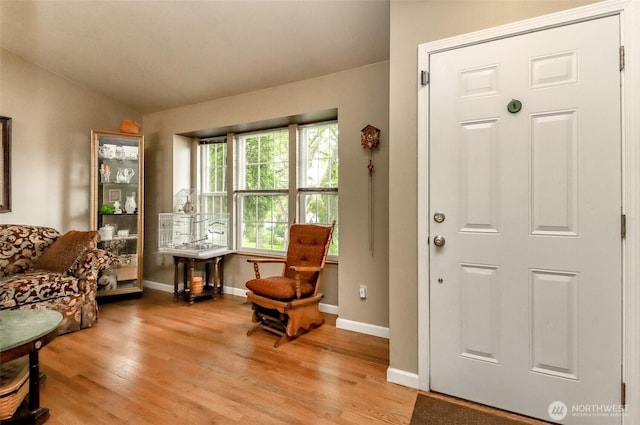 103 Schmid St, Enumclaw, WA 98022 - sitting room with lofted ceiling, light wood finished floors, and baseboards