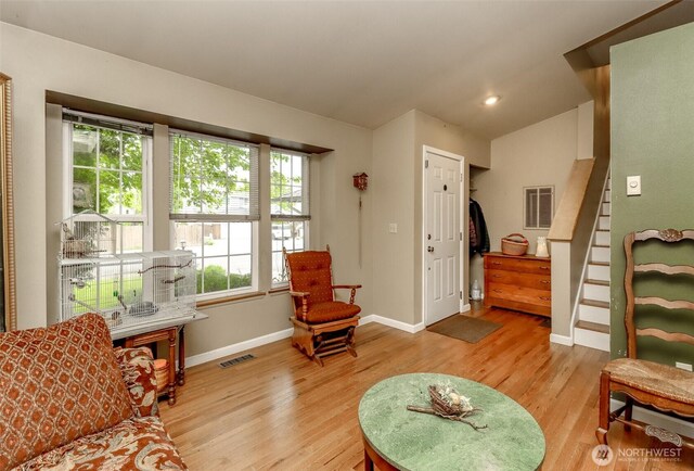 103 Schmid St, Enumclaw, WA 98022 - living area featuring vaulted ceiling, light wood-style flooring, baseboards, and stairs