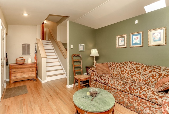 103 Schmid St, Enumclaw, WA 98022 - living room featuring wood finished floors, stairway, baseboards, and recessed lighting