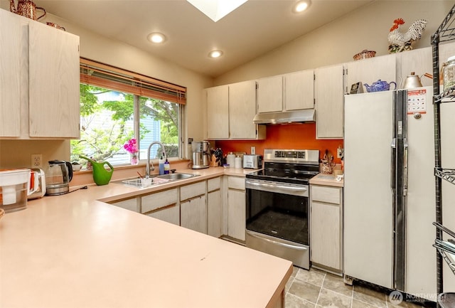 103 Schmid St, Enumclaw, WA 98022 - kitchen featuring stainless steel range with electric cooktop, under cabinet range hood, a sink, freestanding refrigerator, and light countertops