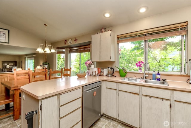 103 Schmid St, Enumclaw, WA 98022 - kitchen with stainless steel dishwasher, a sink, light countertops, a peninsula, and lofted ceiling