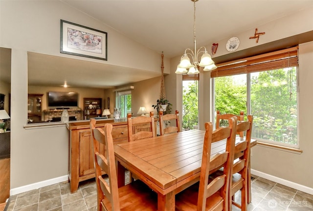 103 Schmid St, Enumclaw, WA 98022 - dining room featuring lofted ceiling, a chandelier, baseboards, and light tile patterned floors