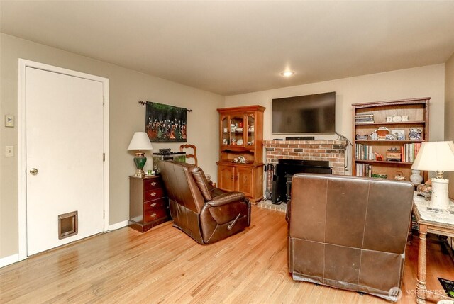 103 Schmid St, Enumclaw, WA 98022 - living room featuring a fireplace, light wood finished floors, and recessed lighting