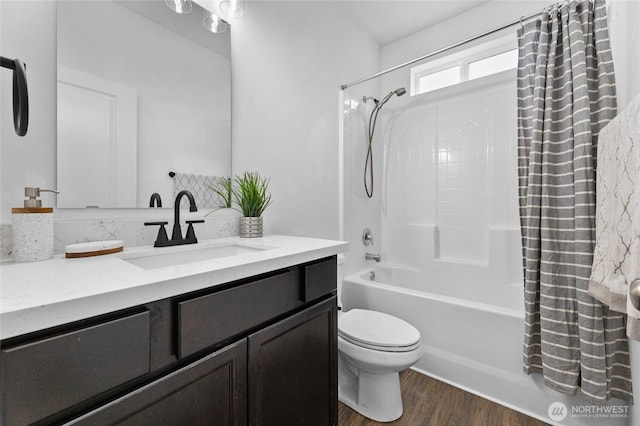 12921 224th St E, Graham, WA 98338 - bathroom with wood finished floors, vanity, shower / bath combo, and toilet