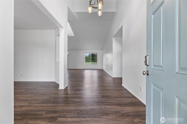 12921 224th St E, Graham, WA 98338 - entryway featuring dark wood-type flooring, a chandelier, and baseboards