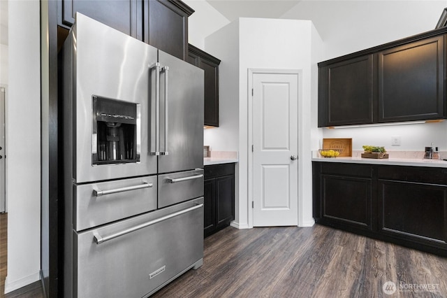 12921 224th St E, Graham, WA 98338 - kitchen with stainless steel fridge, dark wood-style floors, light countertops, and baseboards