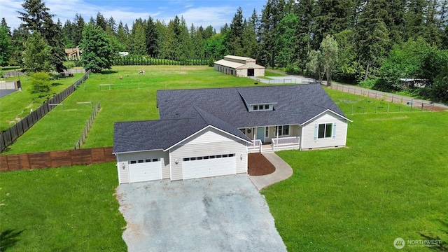 12921 224th St E, Graham, WA 98338 - view of front of house with a porch, driveway, an attached garage, and roof with shingles