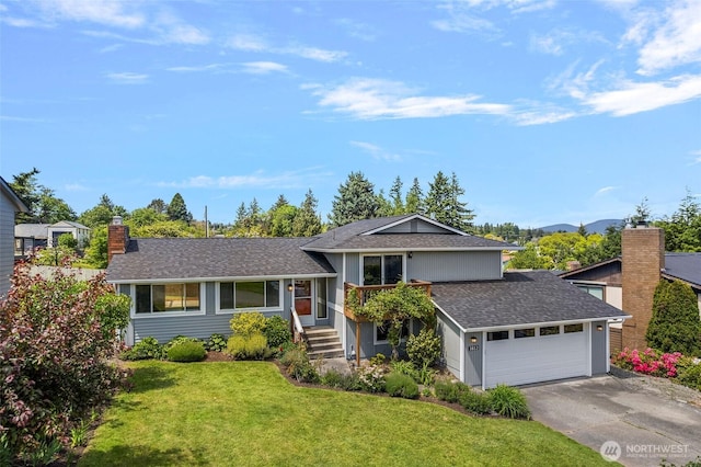 3812 R Ave, Anacortes, WA 98221 - split level home featuring roof with shingles, a chimney, a front lawn, an attached garage, and driveway