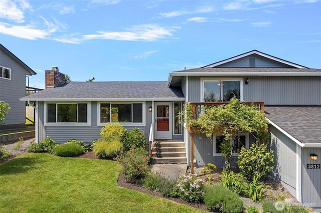 3812 R Ave, Anacortes, WA 98221 - view of front of home with a front lawn, roof with shingles, and a chimney