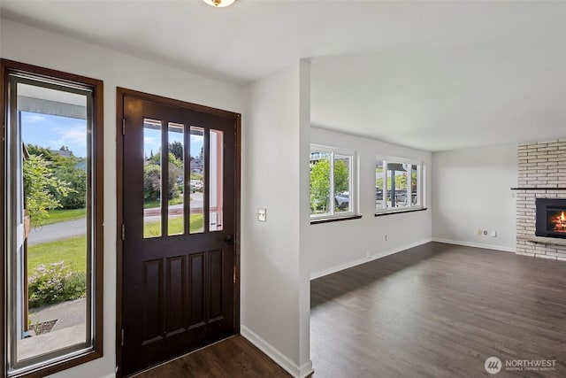 3812 R Ave, Anacortes, WA 98221 - foyer entrance with dark wood finished floors, baseboards, and a fireplace