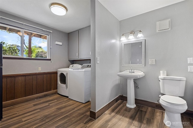 3812 R Ave, Anacortes, WA 98221 - bathroom featuring independent washer and dryer, wood finished floors, toilet, and a sink