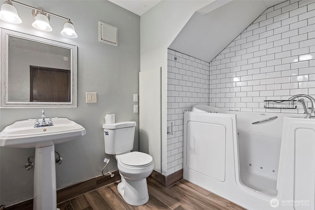 3812 R Ave, Anacortes, WA 98221 - bathroom featuring wood finished floors, lofted ceiling, and toilet