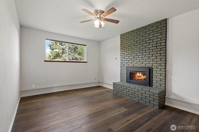3812 R Ave, Anacortes, WA 98221 - unfurnished living room with a ceiling fan, a fireplace, wood finished floors, and baseboards