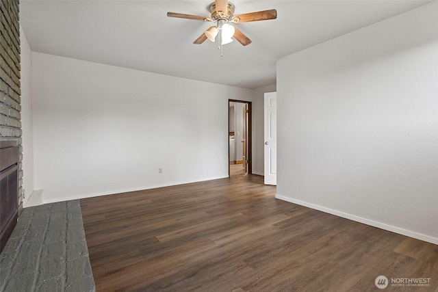 3812 R Ave, Anacortes, WA 98221 - unfurnished living room featuring dark wood-type flooring, ceiling fan, a fireplace, and baseboards