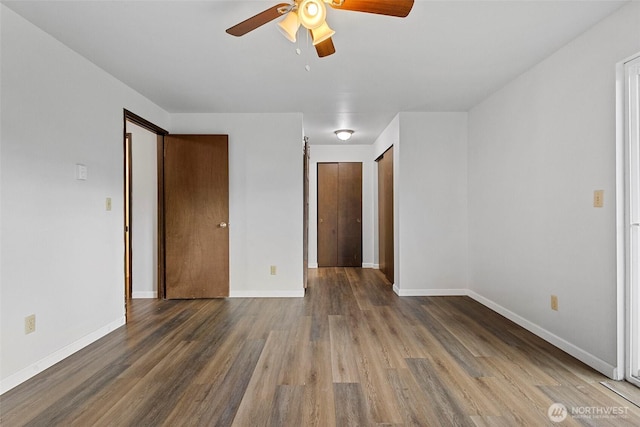 3812 R Ave, Anacortes, WA 98221 - unfurnished bedroom with wood finished floors, baseboards, and a ceiling fan
