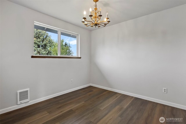 3812 R Ave, Anacortes, WA 98221 - spare room with a chandelier, dark wood-type flooring, baseboards, and heating unit