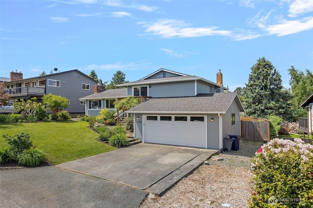 3812 R Ave, Anacortes, WA 98221 - tri-level home with driveway, a chimney, a shingled roof, and an attached garage