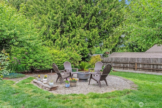 view of yard with a fire pit