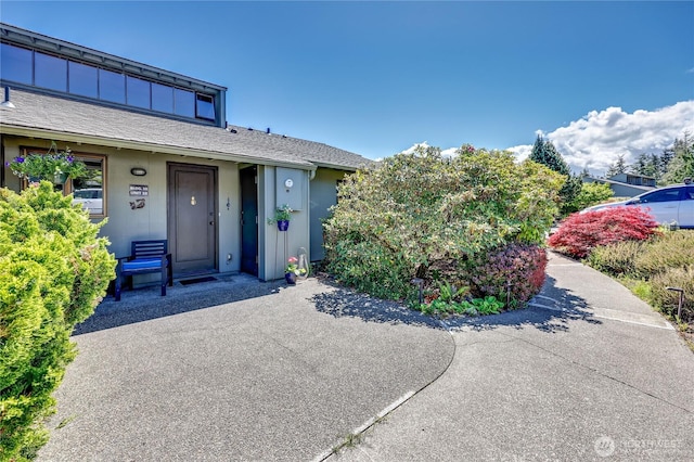 10 Olympic Pl Unit 10, Port Ludlow, WA 98365 - view of front facade featuring stucco siding