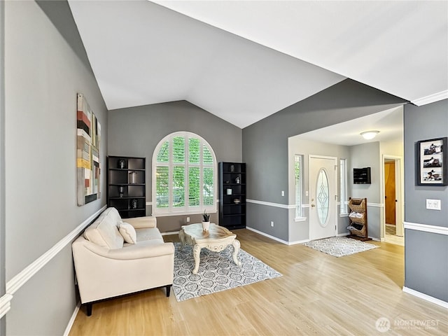 4207 Campus Green Loop NE, Lacey, WA 98516 - living room featuring wood finished floors, baseboards, and vaulted ceiling