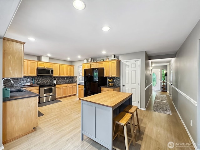 4207 Campus Green Loop NE, Lacey, WA 98516 - kitchen with appliances with stainless steel finishes, a sink, backsplash, light wood finished floors, and recessed lighting