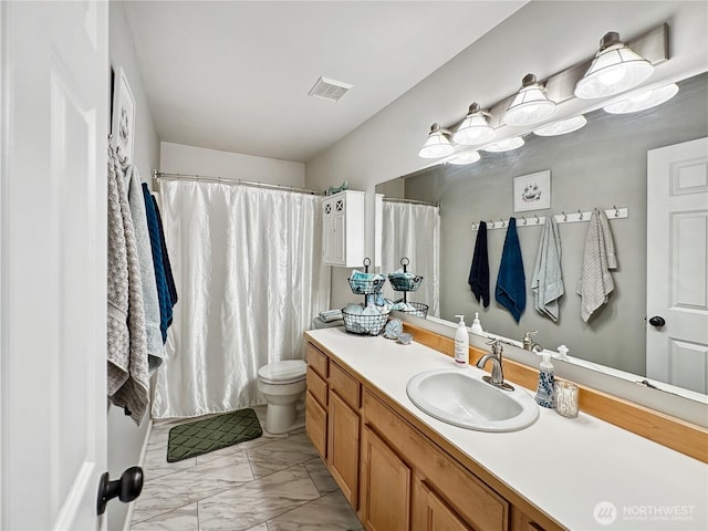 4207 Campus Green Loop NE, Lacey, WA 98516 - full bath with marble finish floors, vanity, toilet, and a shower with curtain