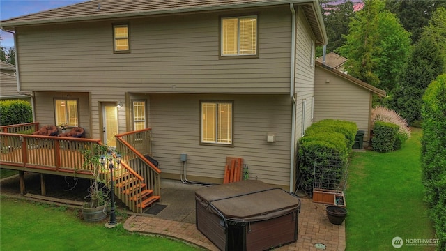 4207 Campus Green Loop NE, Lacey, WA 98516 - back of house with a hot tub, a wooden deck, a patio, and a yard