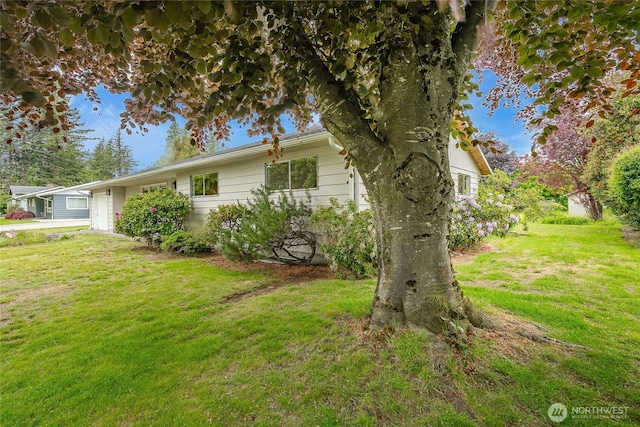 924 Pine St, Lynden, WA 98264 - view of property exterior featuring a yard and an attached garage