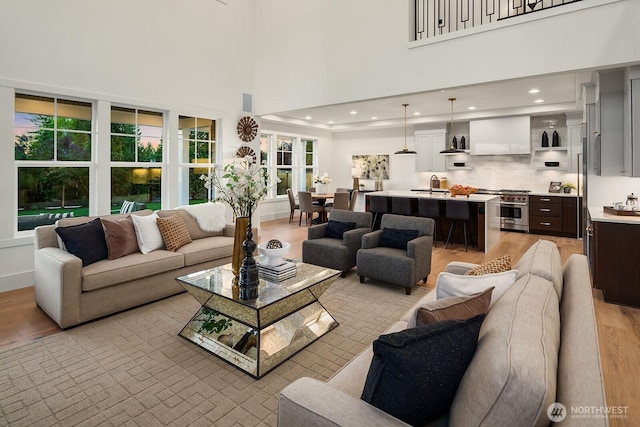 3976 154th Ave SE, Bellevue, WA 98006 - living area with light wood finished floors, a high ceiling, and recessed lighting
