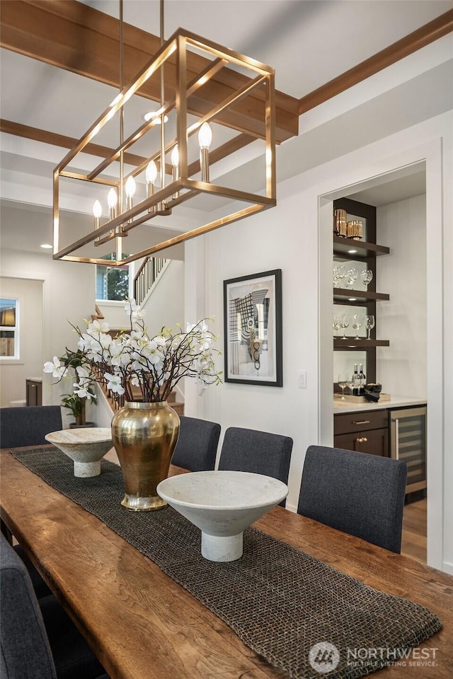 3976 154th Ave SE, Bellevue, WA 98006 - dining space featuring beverage cooler, a dry bar, and wood finished floors