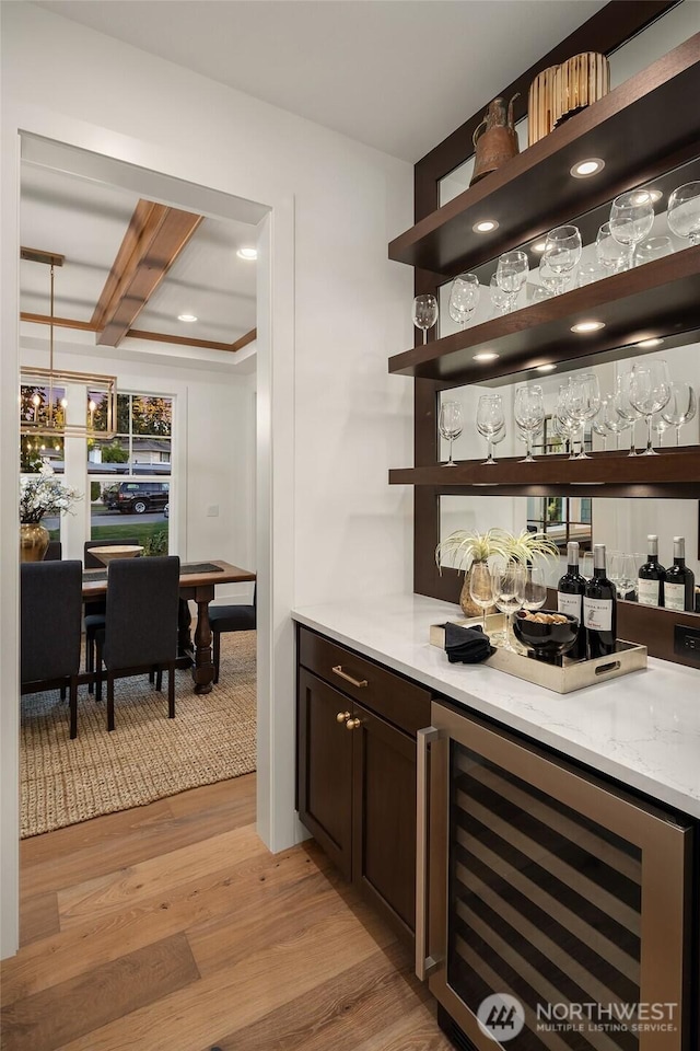 3976 154th Ave SE, Bellevue, WA 98006 - indoor dry bar featuring wine cooler, light wood-style flooring, and beam ceiling