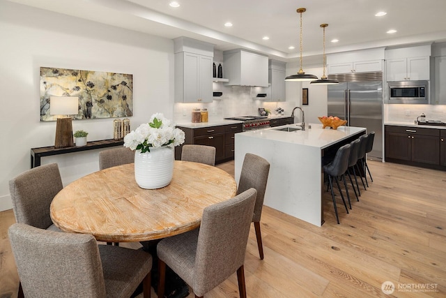 3976 154th Ave SE, Bellevue, WA 98006 - dining space with light wood-style flooring and recessed lighting