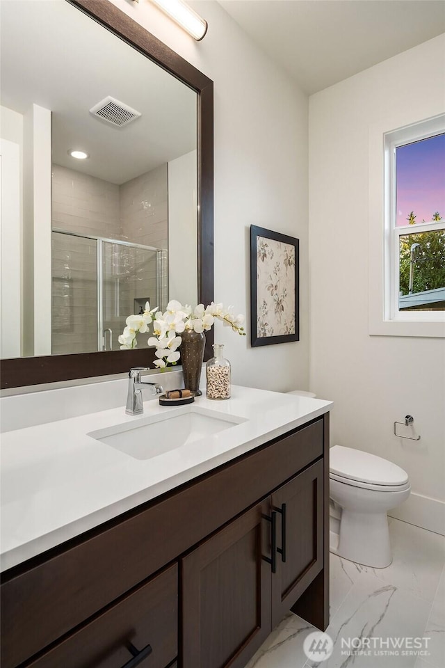 3976 154th Ave SE, Bellevue, WA 98006 - bathroom featuring marble finish flooring, a shower stall, vanity, and toilet