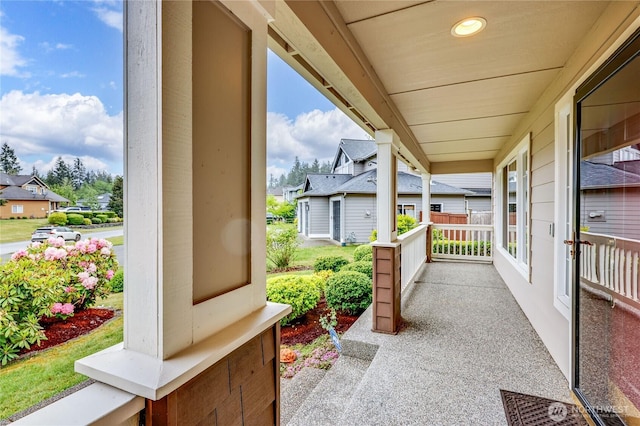 view of patio / terrace with a porch and a residential view
