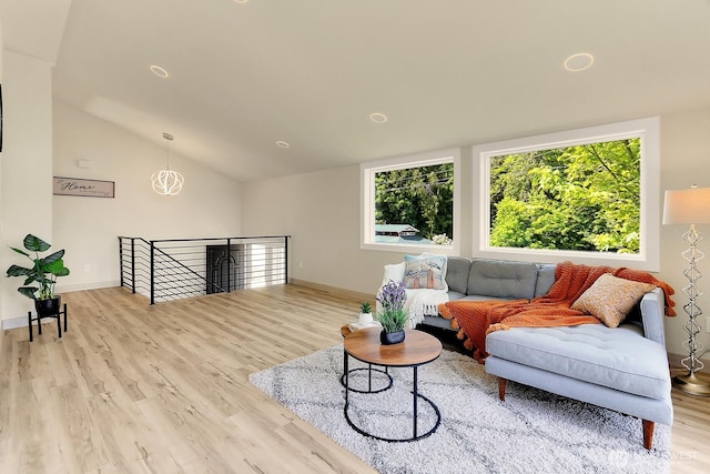 9630 SE Driftwood Dr, Port Orchard, WA 98367 - living room with plenty of natural light, wood finished floors, vaulted ceiling, and baseboards