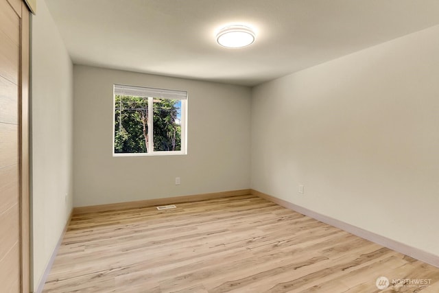 9630 SE Driftwood Dr, Port Orchard, WA 98367 - empty room with light wood-style floors and baseboards