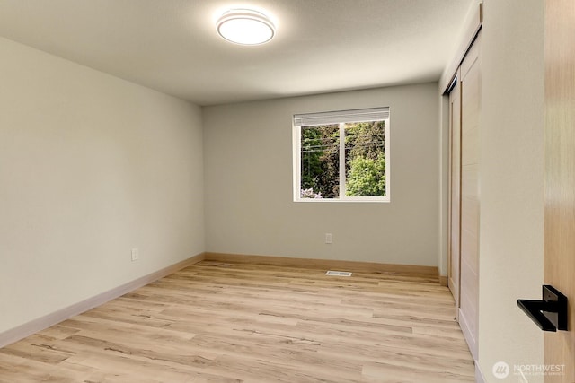 9630 SE Driftwood Dr, Port Orchard, WA 98367 - unfurnished room with light wood-type flooring and baseboards